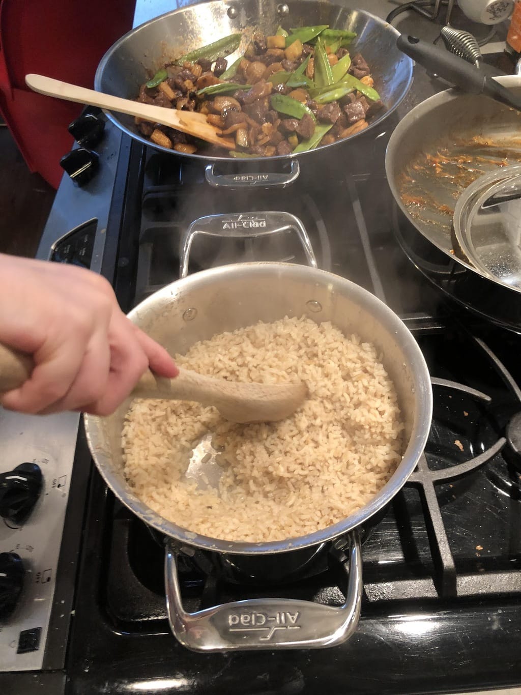 Child stirring rice with spoon