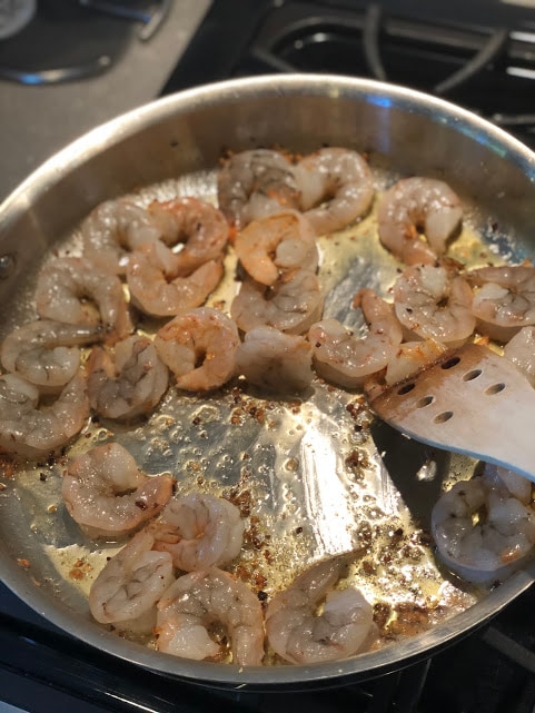 Child stirring shrimp
