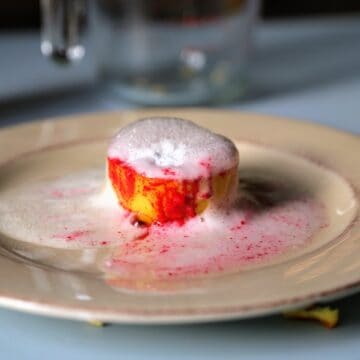 Erupting lemon volcano with red paint and bubbles.