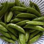Sugar snap peas in strainer