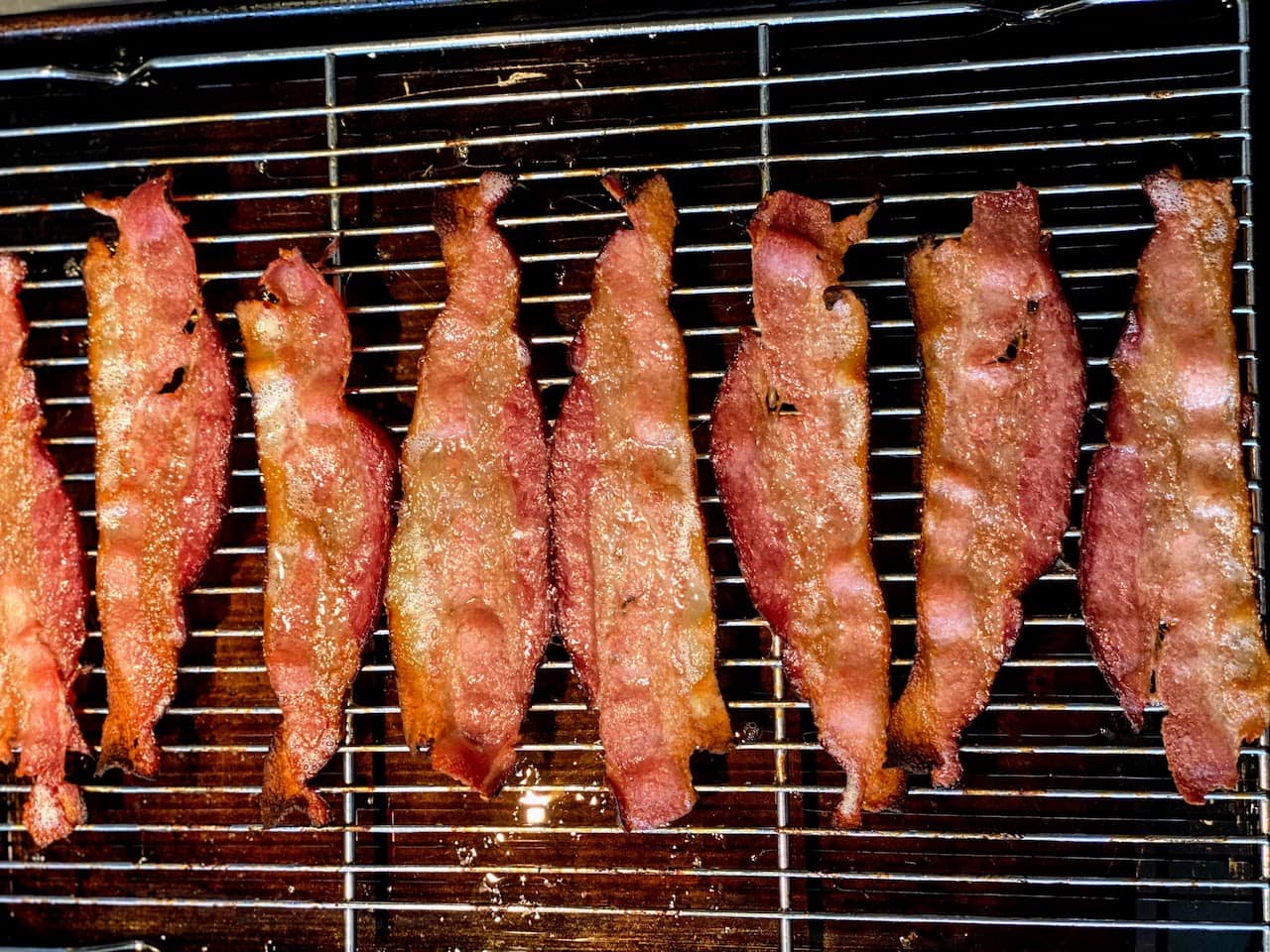 strips of cooked bacon on wire rack in rimmed baking sheet