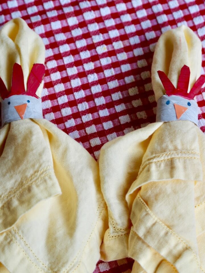 chicken napkin rings holding yellow napkins