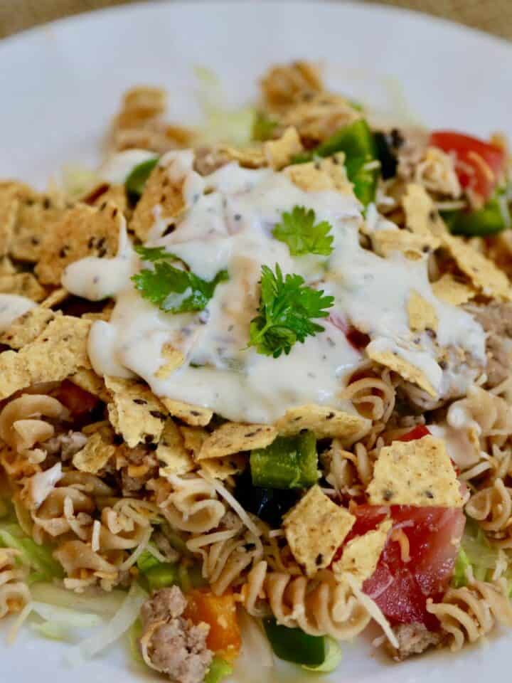 crunchy taco salad on a white plate
