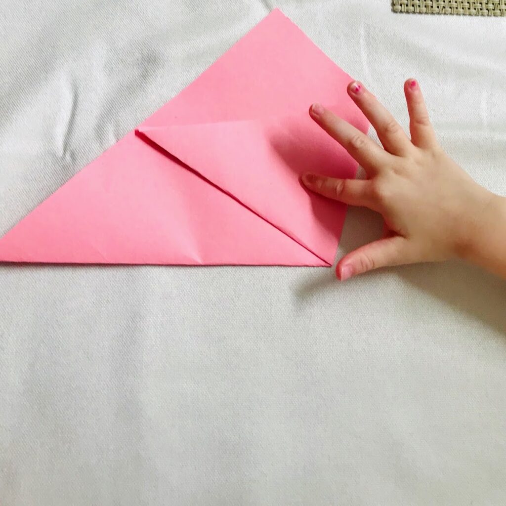 folding first half of paper triangle