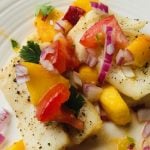 baked cod and peach salsa on plate