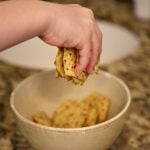 CHILD CRUSHING CHIPS WITH HANDS