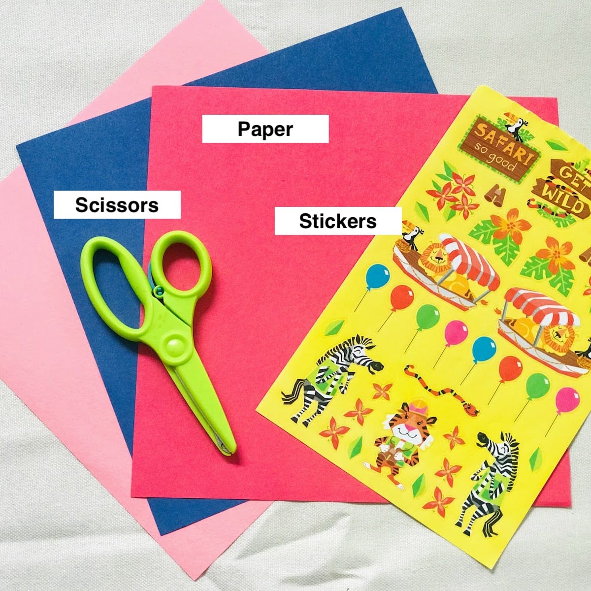 scissors paper and stickers for paper bag craft