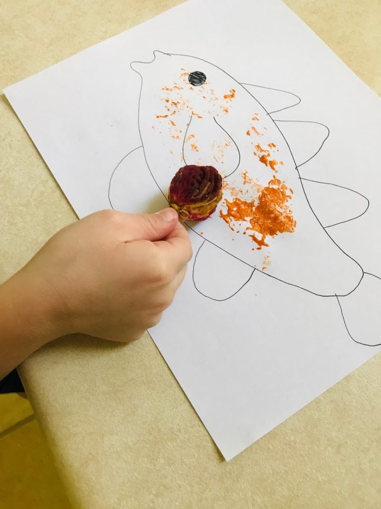 stamping peach core onto paper