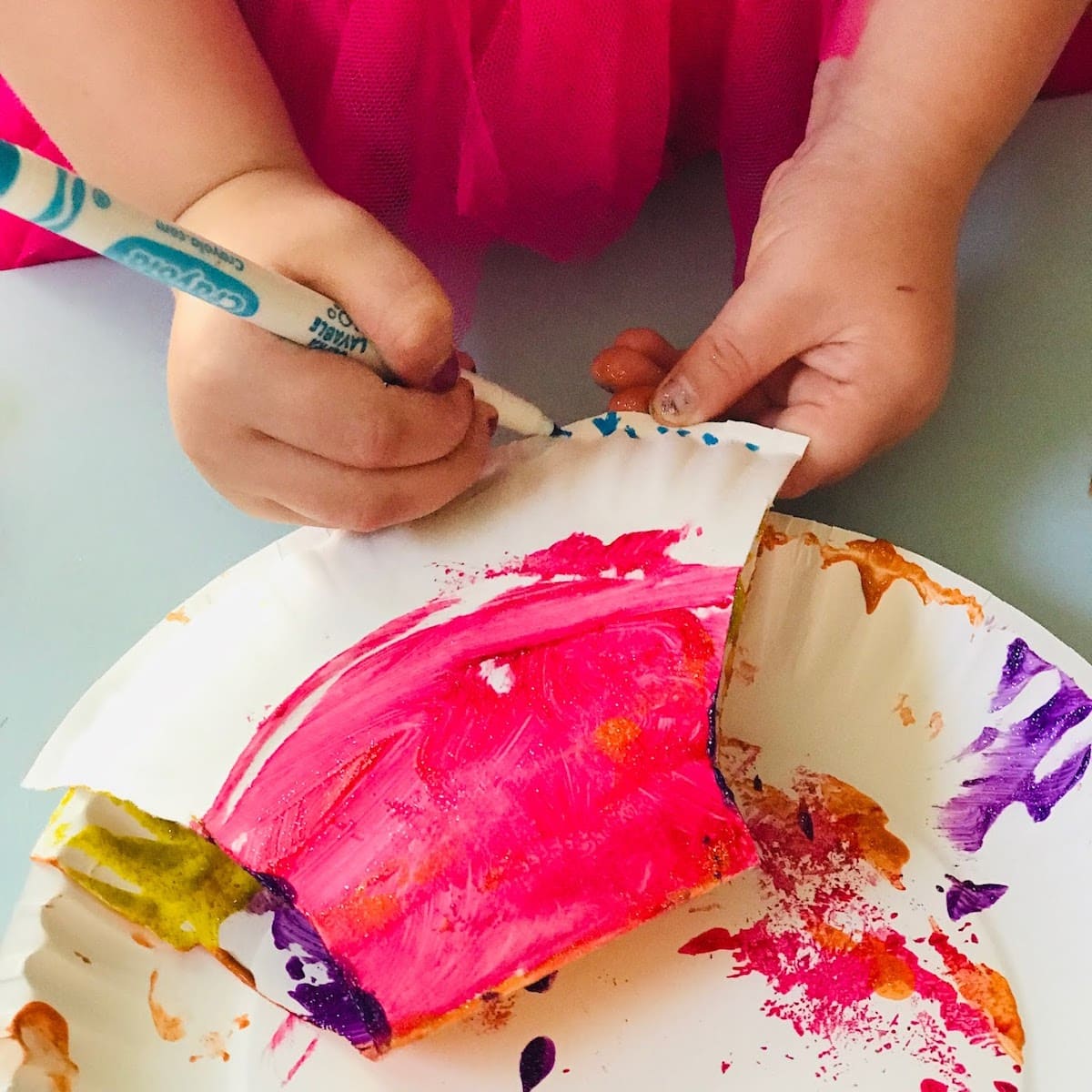 painting eyes on scallop craft