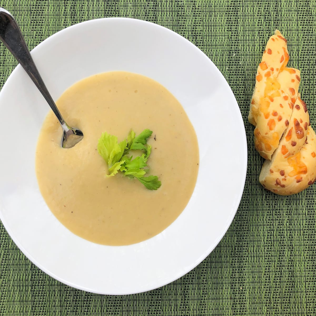 Potato Leek Soup with spoon and bread