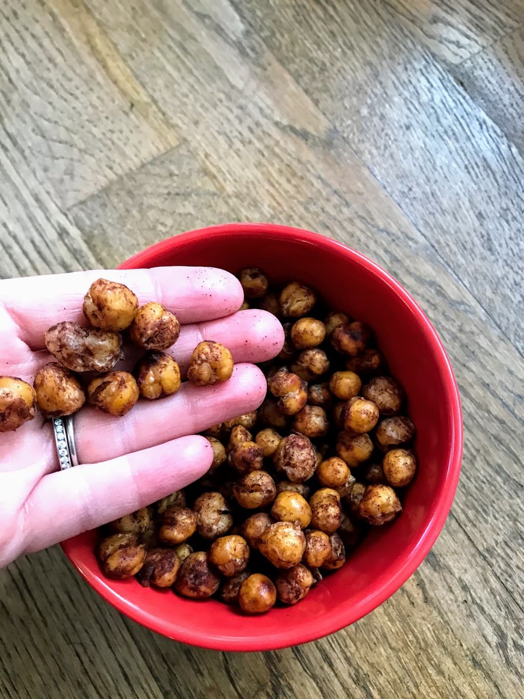 hand holding roasted chickpeas