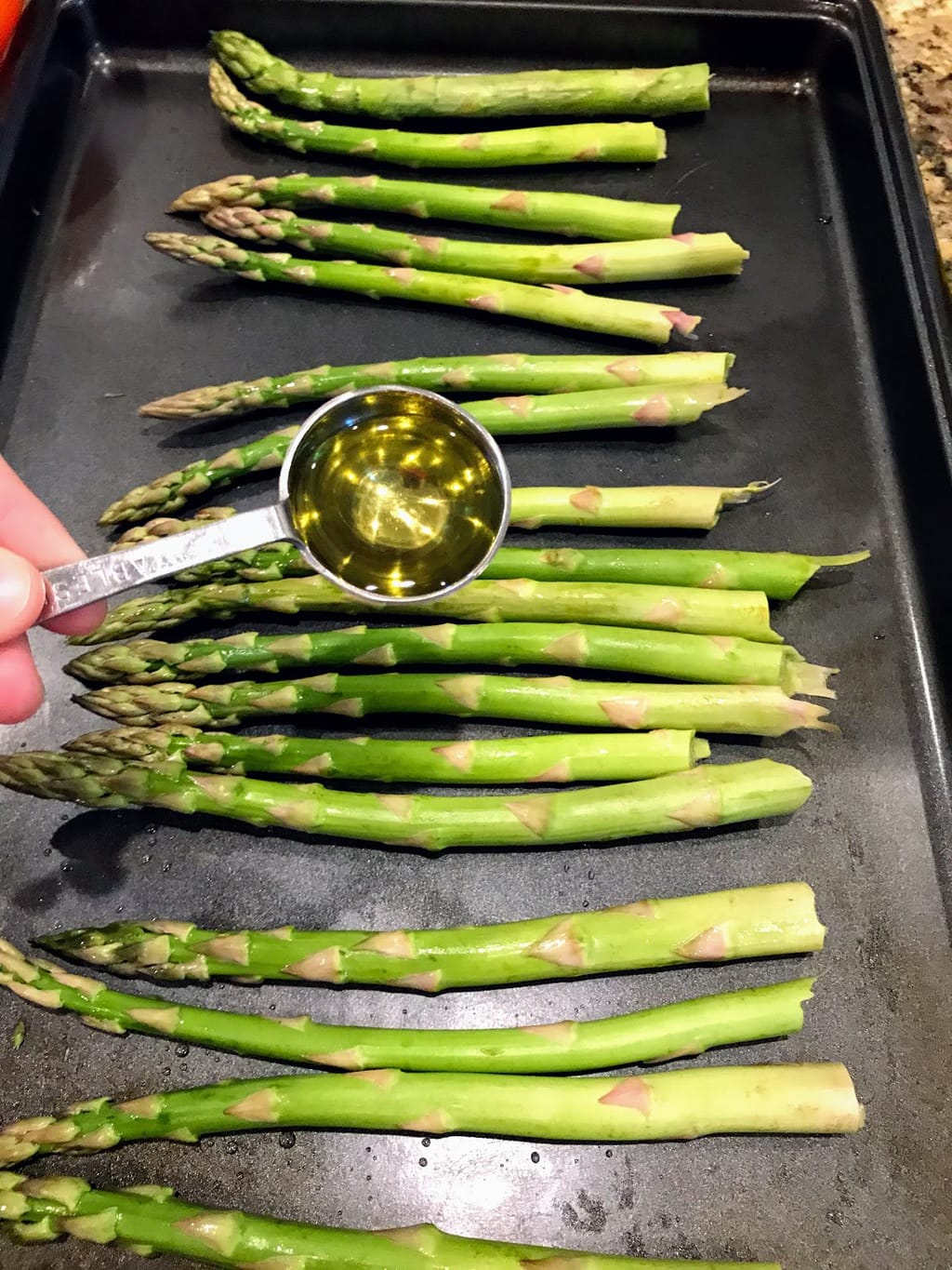 add oil to asparagus