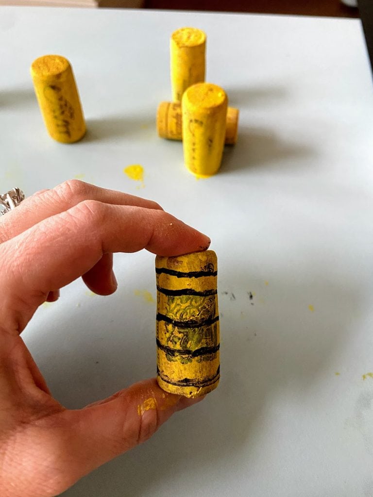 cork honeybee painted yellow with black stripes