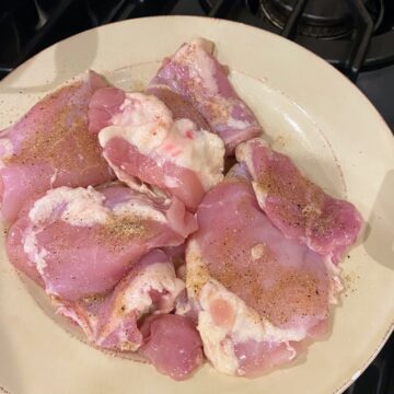 seasoned chicken thighs on plate
