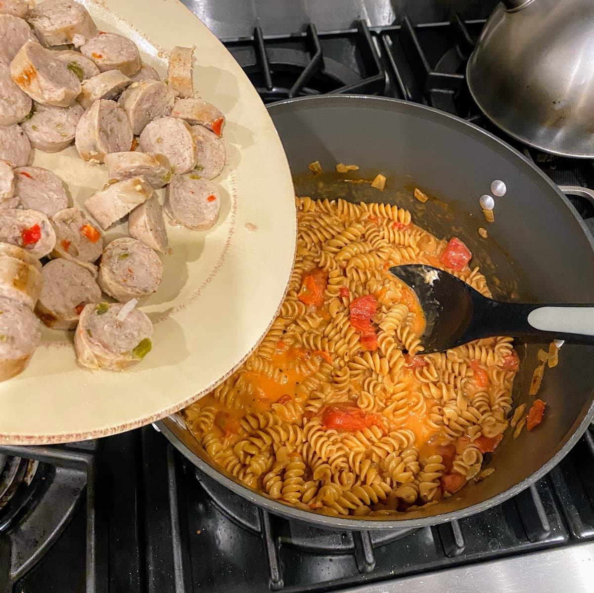 adding sausage back to pasta