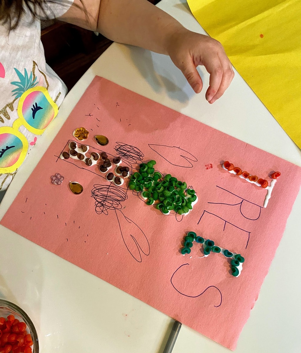Child's picture of tree with colored shells