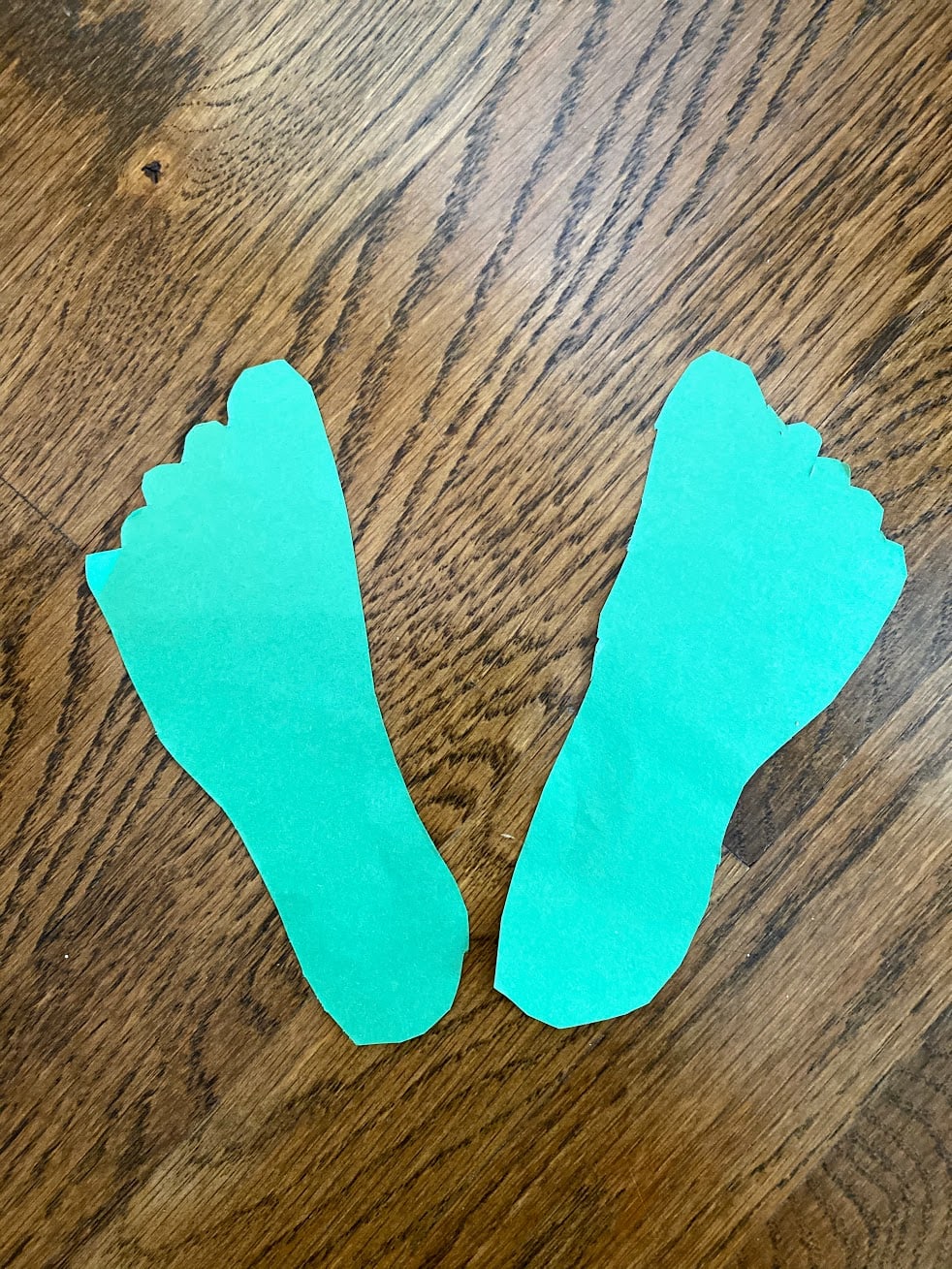 Cutout green footprints