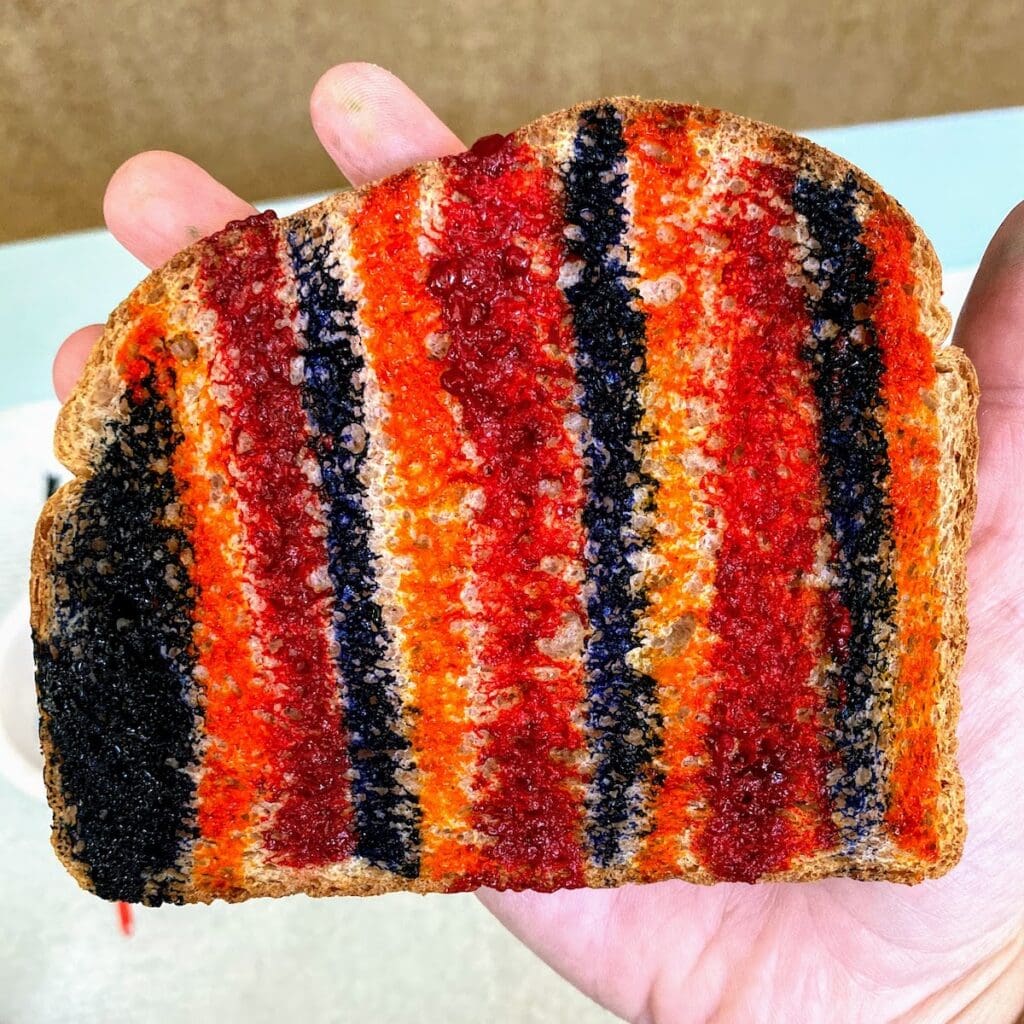 painted toast in hand