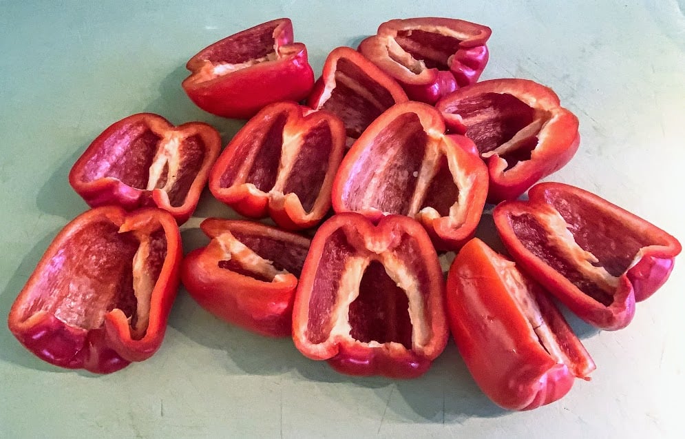 six red bell peppers, cut in half