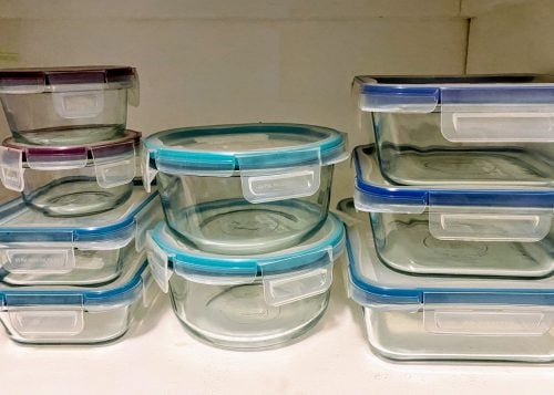 glass food storage containers with blue-rimmed plastic lids, different sizes