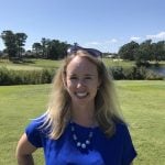 photo of marcie standing in field