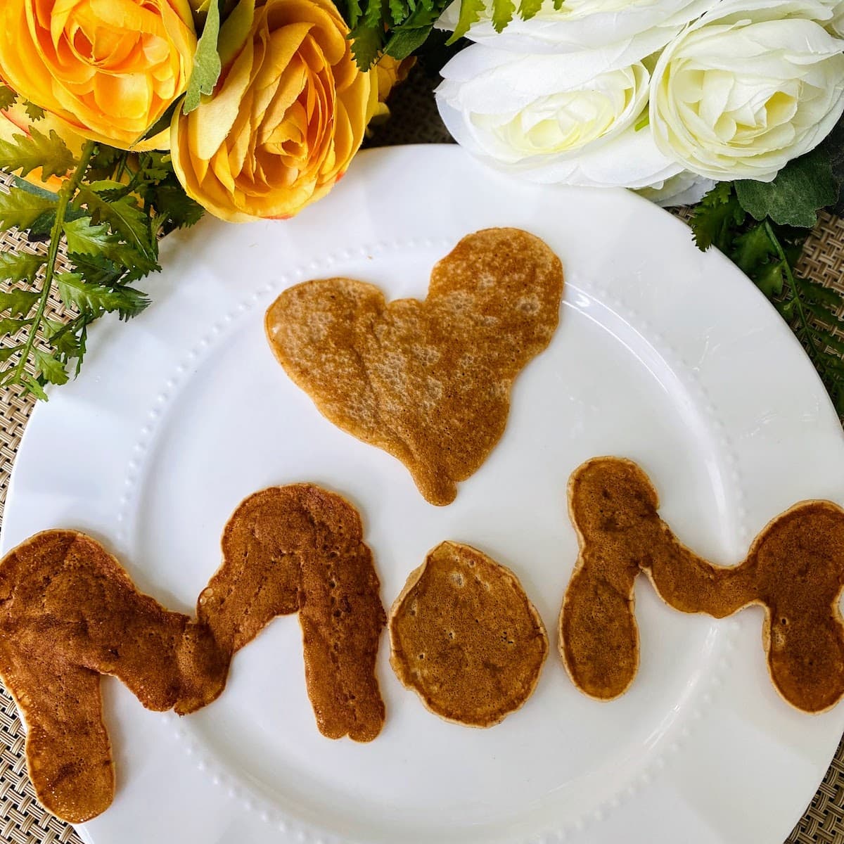 pancakes in shapes of mom letters and heart