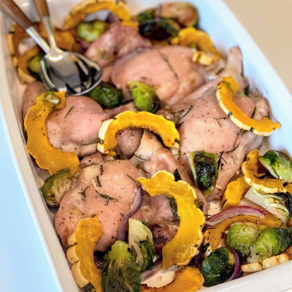 chicken and squash with veggies in casserole dish