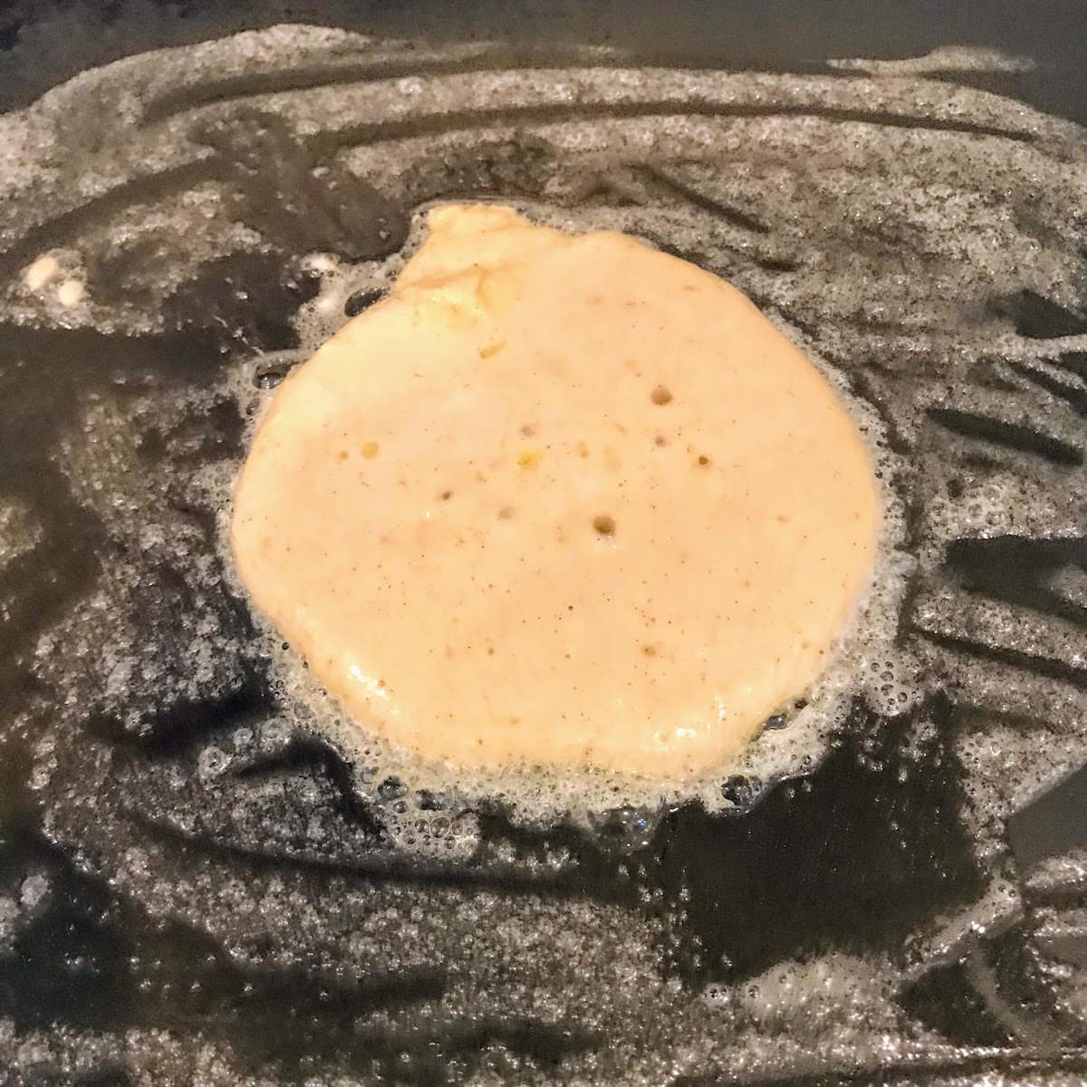 pancake batter on pan
