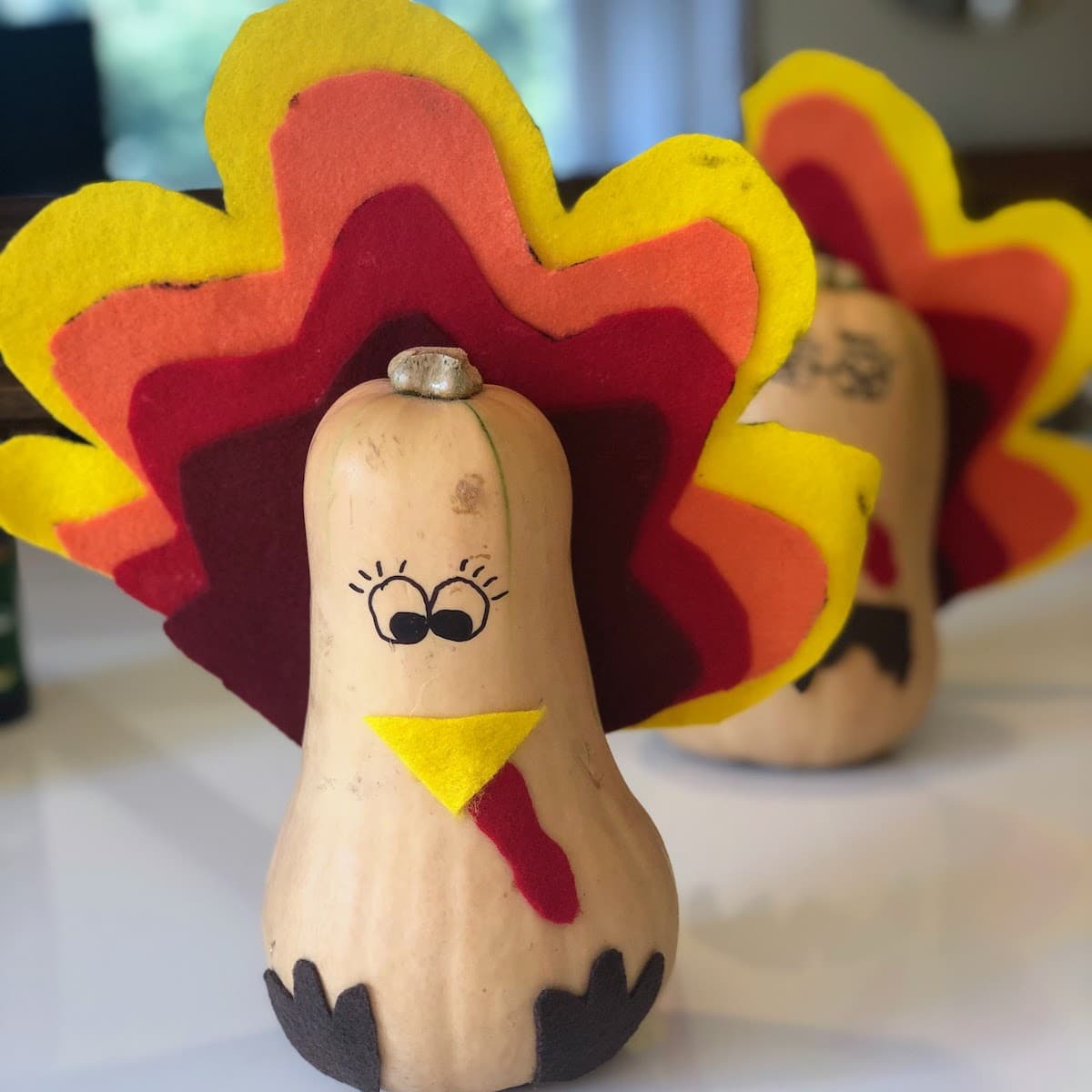 butternut squash decorated as turkeys