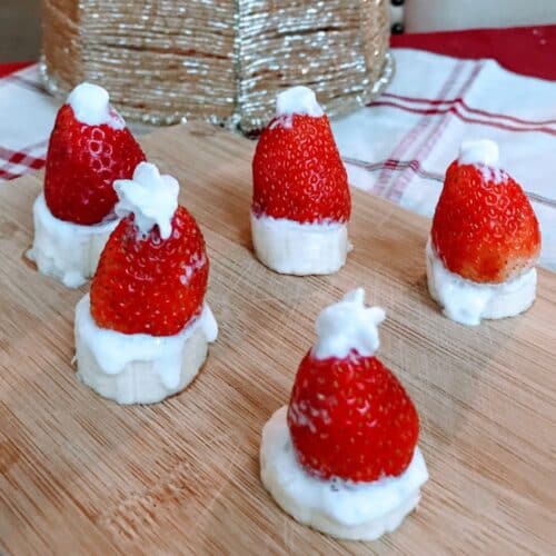 strawberry and whipped cream shaped like santa hats