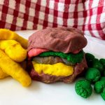 play dough cheeseburger with fries and peas