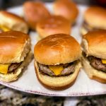 turkey burger sliders with cheese on a plate