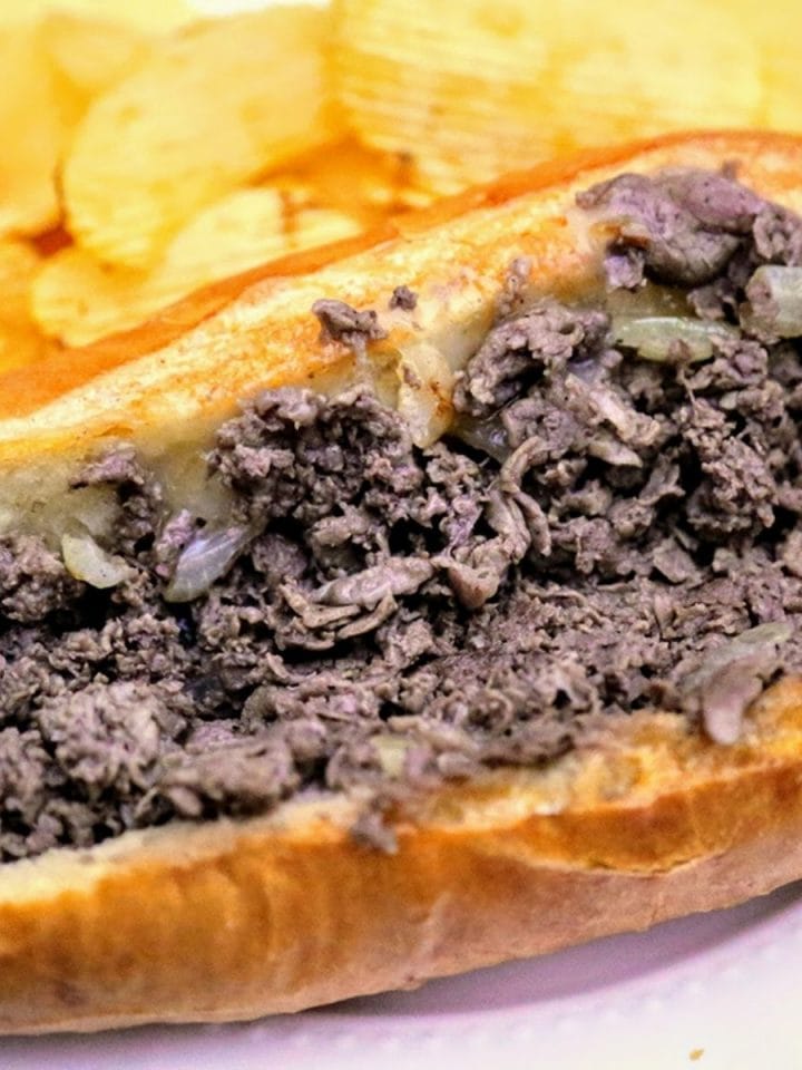 Sandwich with beef, cheese and onion on a long roll