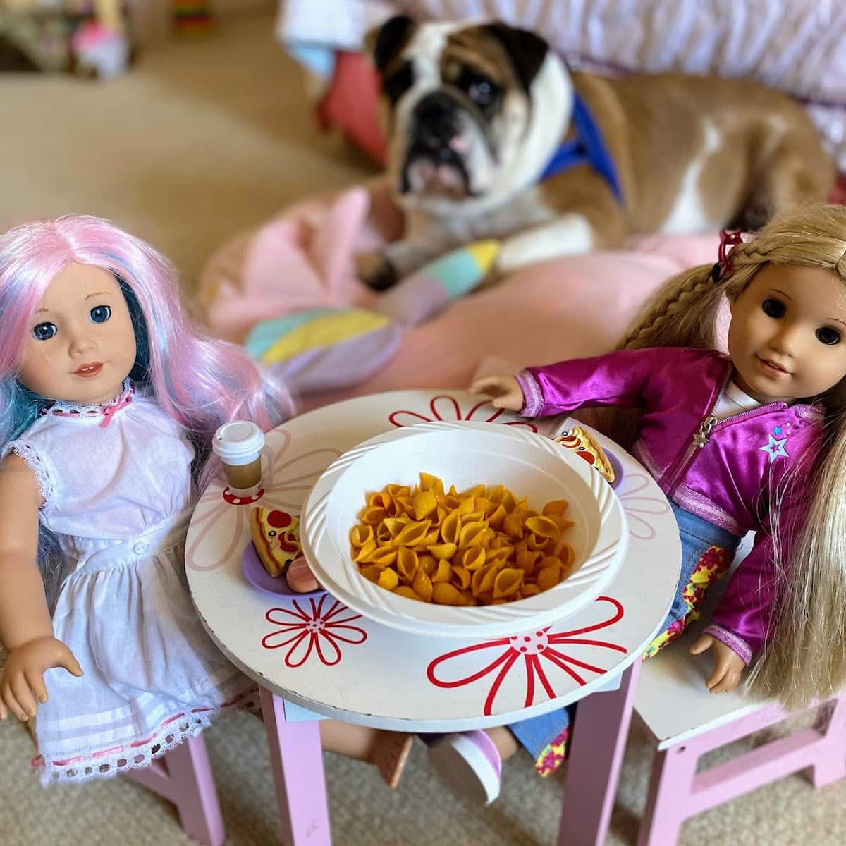 playing with fake mac and cheese with dolls