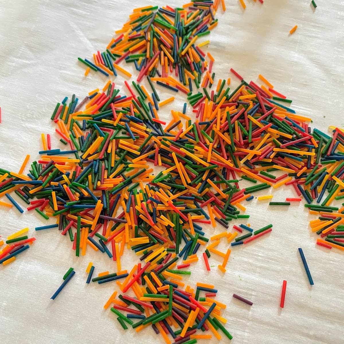 rainbow pasta pieces spread out