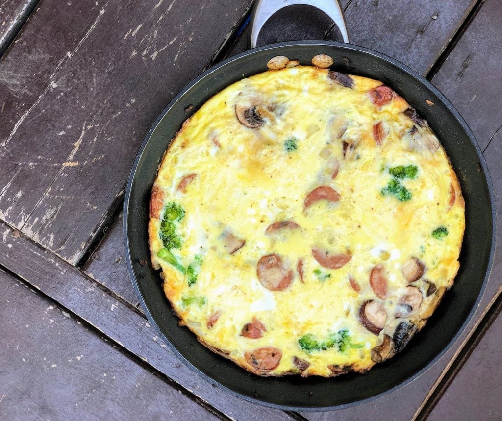 baked frittata in pan with sausage, mushrooms and broccoli