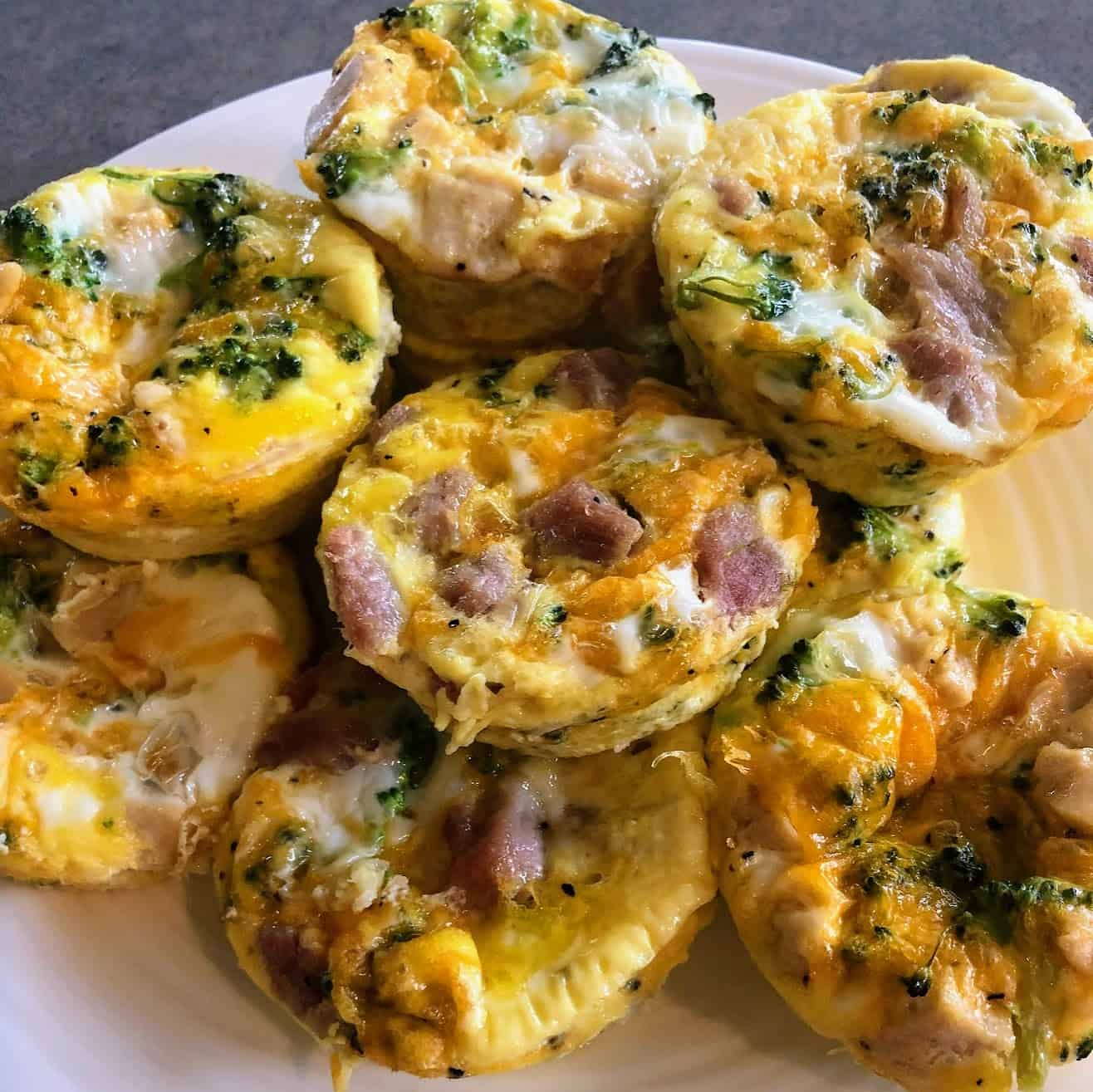 egg bites with ham and cheese stacked 