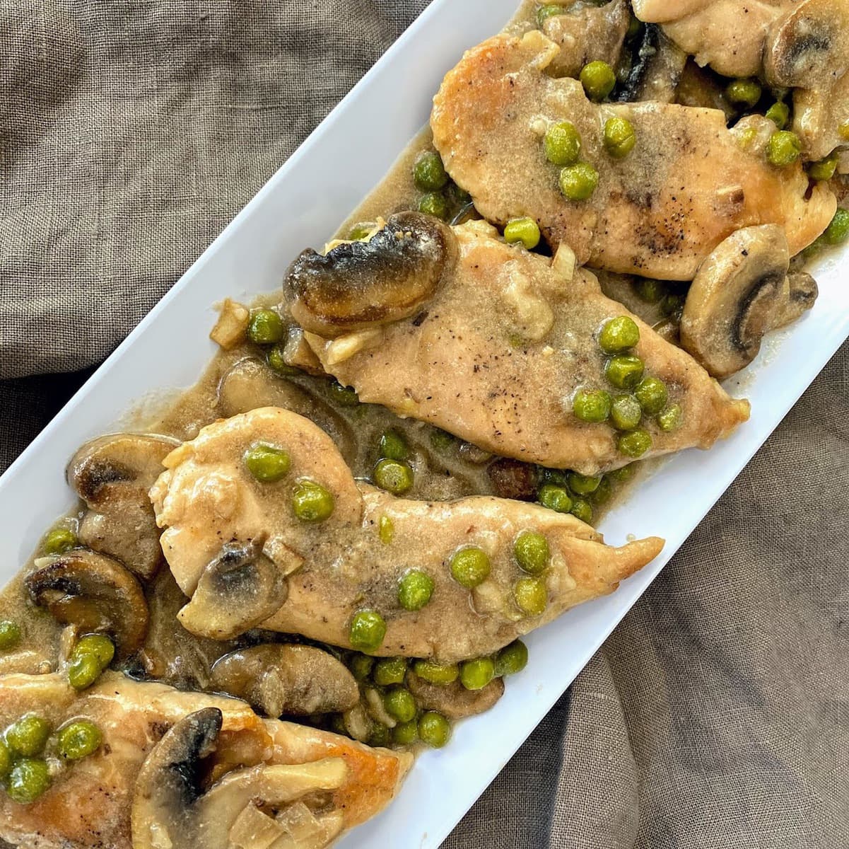 chicken marsala on long white plate