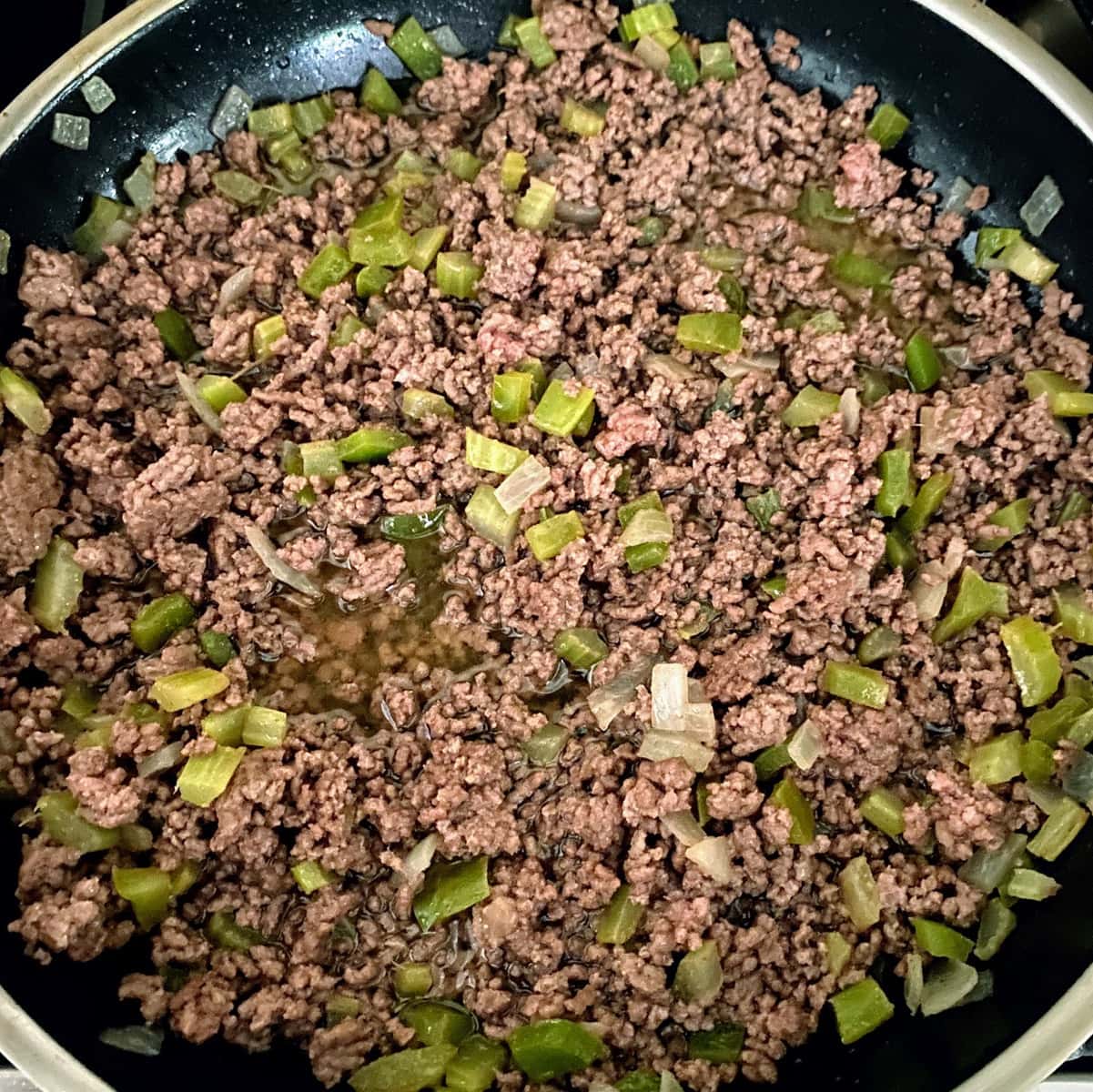 cooking ground beef and veggies for sloppy joes in pan