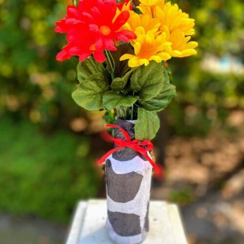 tissue paper vase with red and yellow flowers