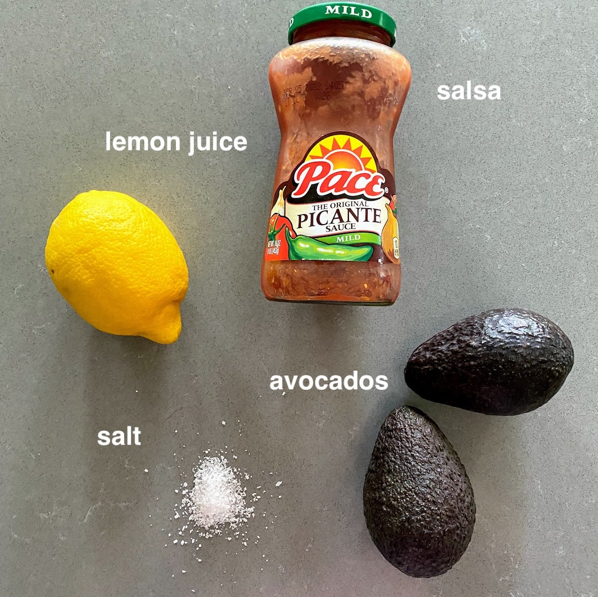 a lemon, salt, 2 avocados and salsa for guacamole