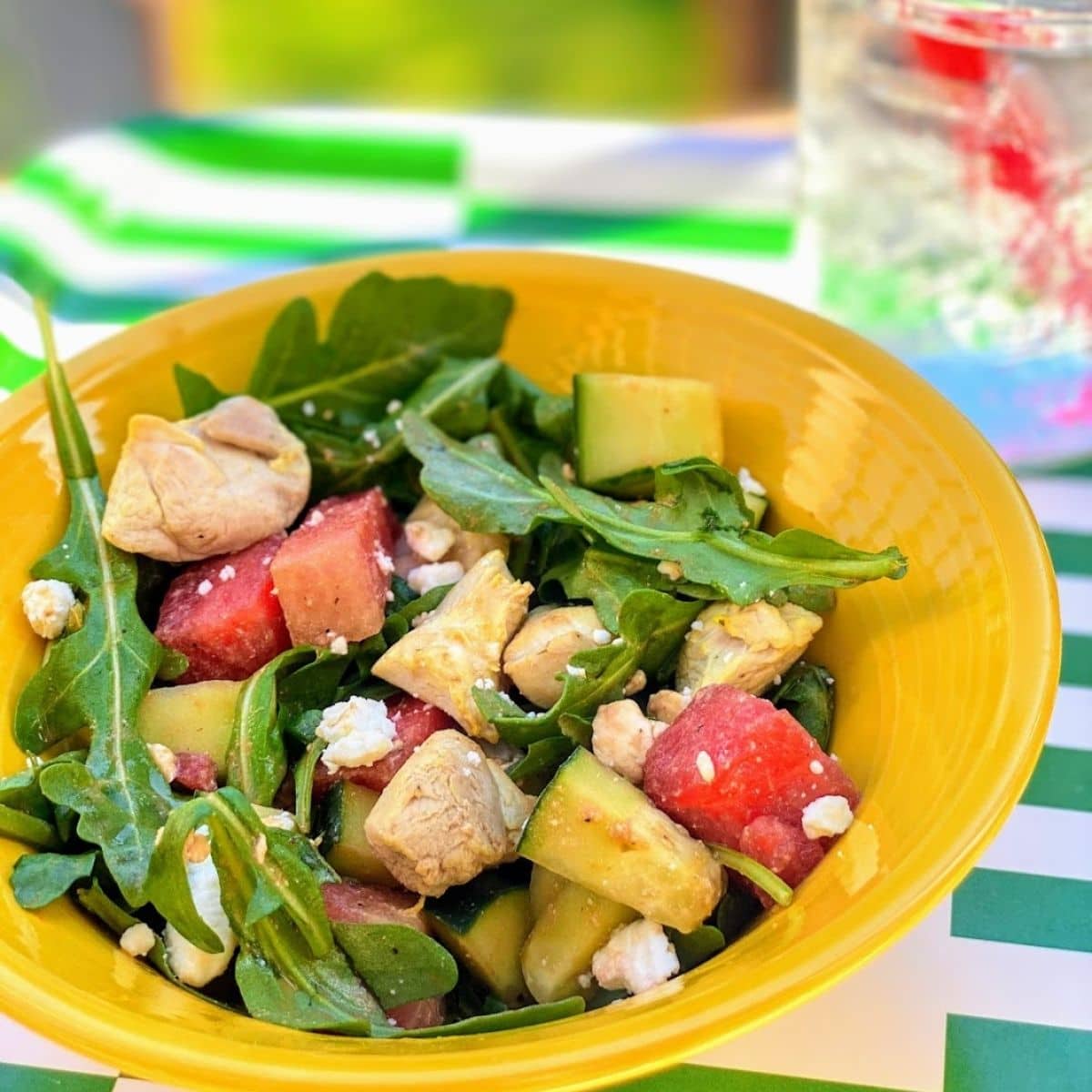 watermelon chicken salad in yellow bowl