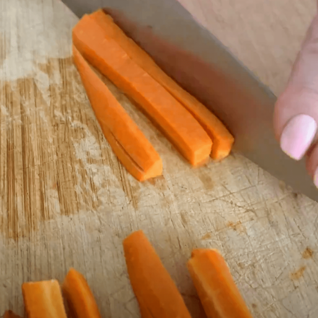 slicing carrots into sticks