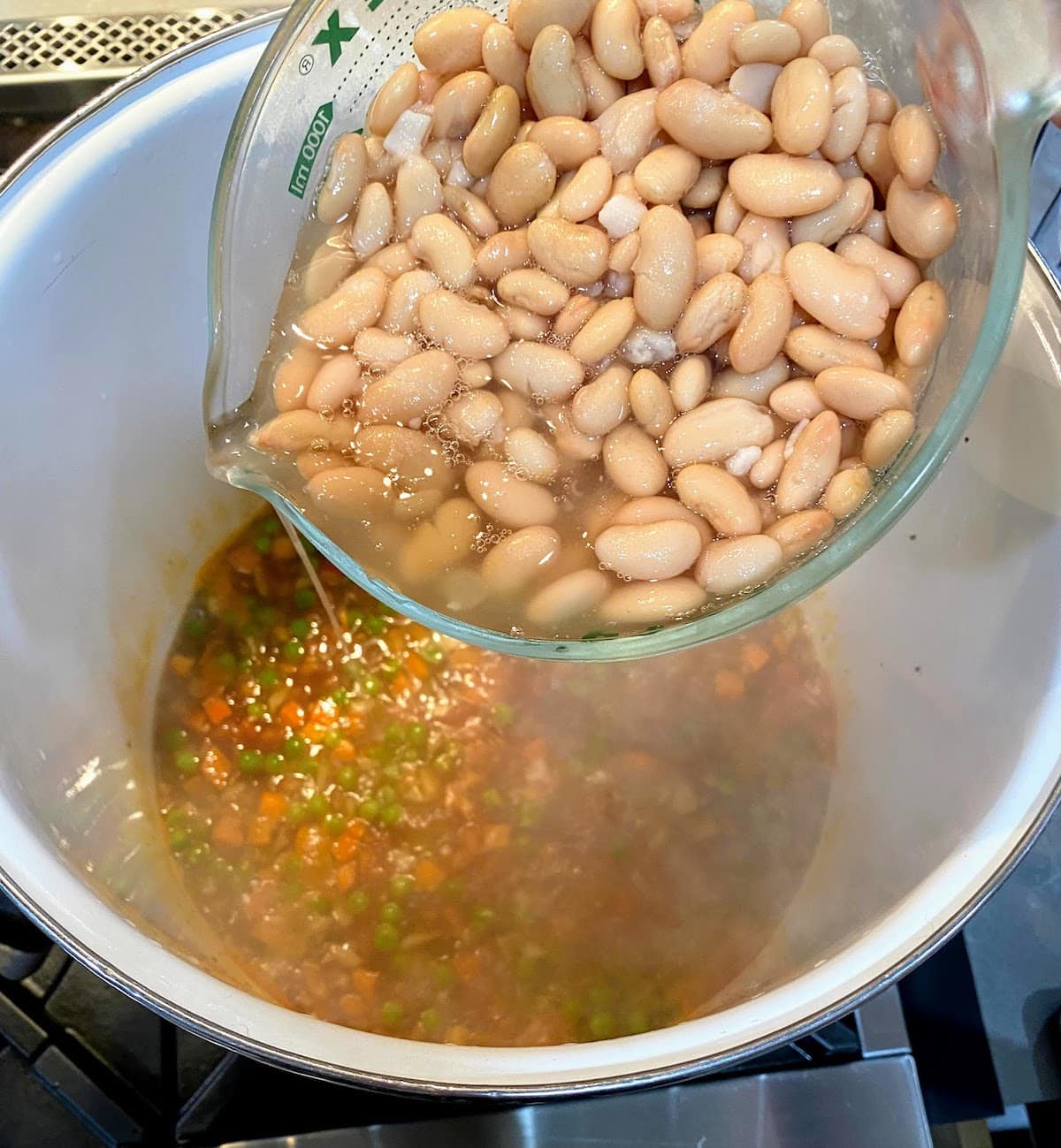 adding beans to italian white bean soup