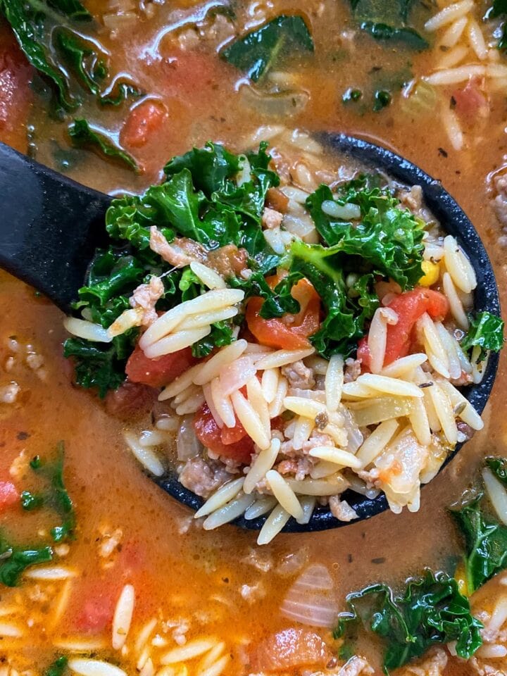 sausage orzo soup with kale in pot