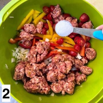 adding salt to veggies and sausage in bowl