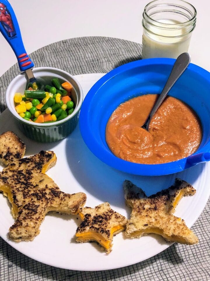 tomato soup, veggies and star and boy shaped grilled cheese