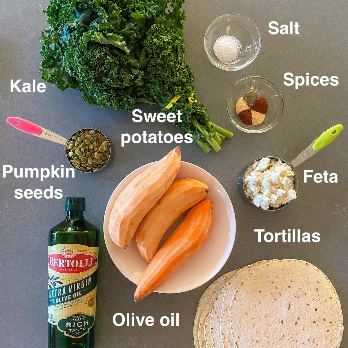 sweet potatoes, kale, pumpkin seeds, feta and other ingredients to make a wrap