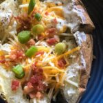 open baked potato with all the fixings