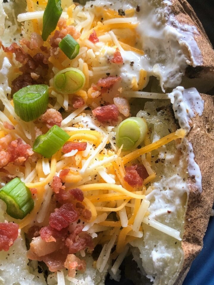 open baked potato with all the fixings